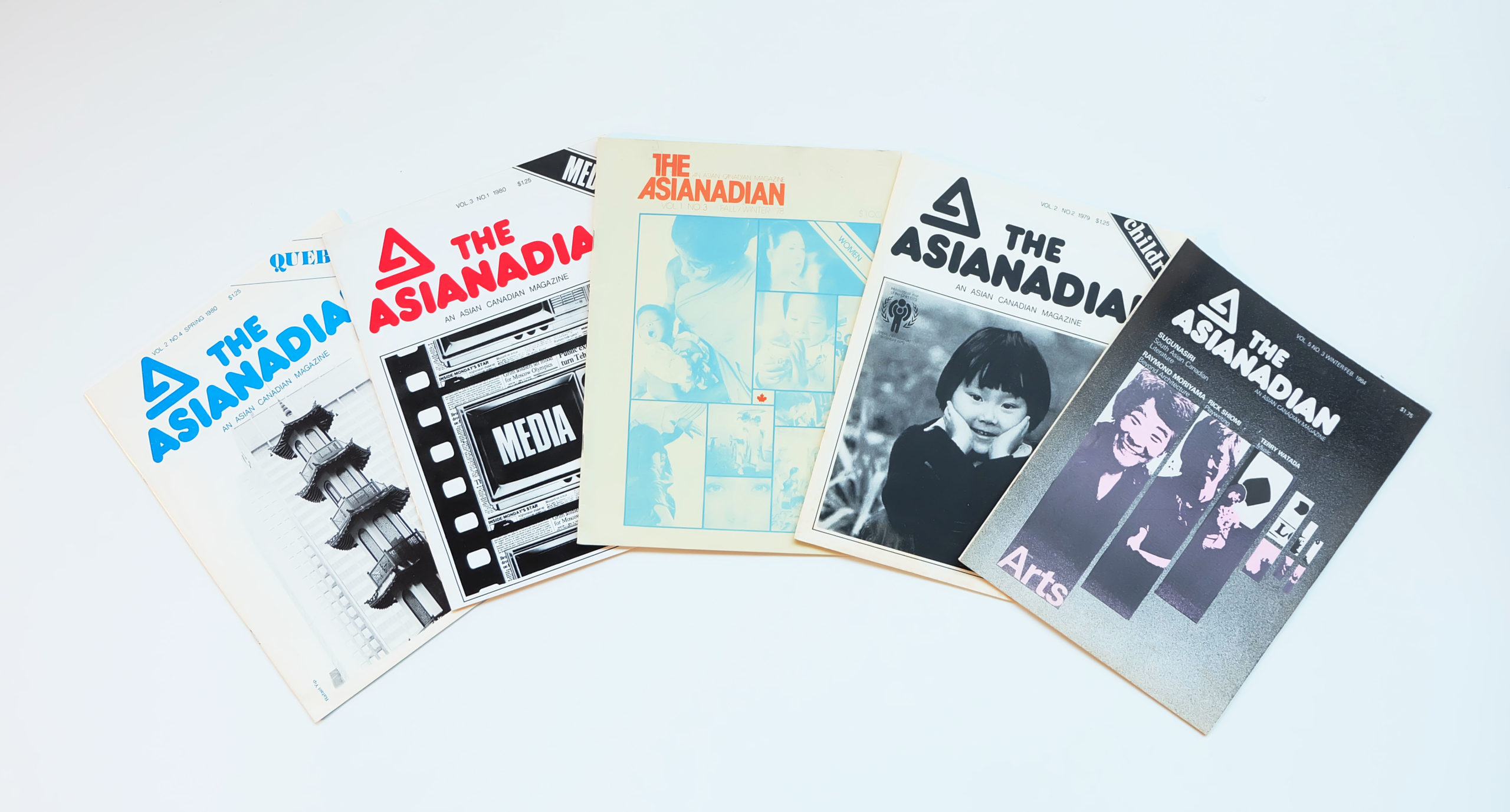 Fanned out covers of old Asianadian magazines